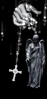 Black and white wallpaper with angel statue and rosary under starry sky.