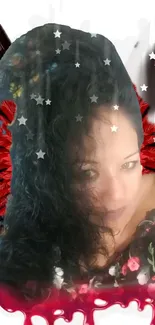 Woman with angelic red wings and starry background.