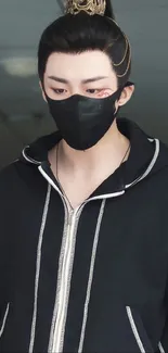 Mystical character in a black hoodie with mask.