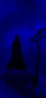 Cloaked figure in blue fog, eerie scene with silhouette.