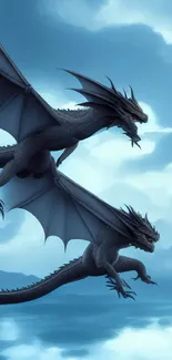 Two dragons flying over a serene ocean with sky blue tones.