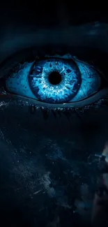 Close-up of a mystical blue eye on a dark background.