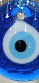 Mystical blue eye amulet with celestial stars.