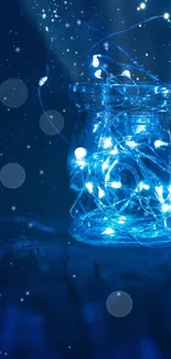 Blue fairy lights glowing inside a glass jar against a starry background.