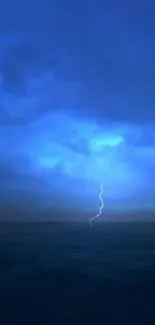 Dark blue sky with a lightning bolt over a calm ocean scene.