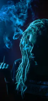 Person surrounded by mystical blue smoke in a shadowy setting.