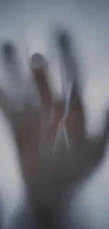 Blurry silhouette of a hand creating an abstract, mysterious effect.