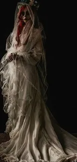 Gothic bride in a flowing white veil against a dark background.