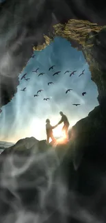 Silhouettes near a cave entrance with birds flying in the evening sky.