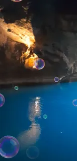 Mystical cave with blue waters and floating bubbles.