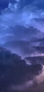 Mobile wallpaper of dark and dramatic night clouds in blue and purple hues.