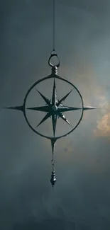 Mystical hanging compass star on dark mobile wallpaper.