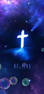 Luminous cross in a galaxy wallpaper with bubbles and 'Believe' text.