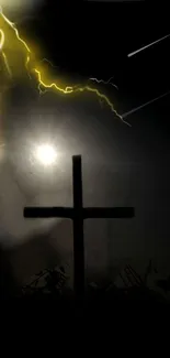 Silhouetted cross with lightning in a dark stormy sky.