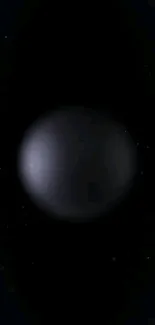 Dark cosmic orb on a black background with faint stars.