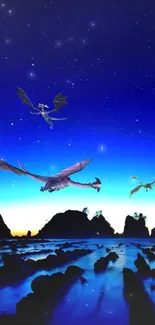 Dragons flying in a starry night sky over a rocky landscape.