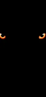 Dark wallpaper with glowing orange eyes.