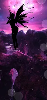 Silhouette of a fairy against a mystical purple night landscape.