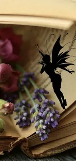 Silhouette of a fairy surrounded by flowers and an open book.