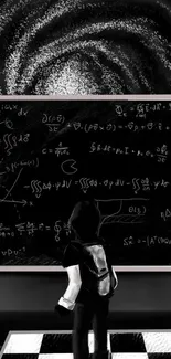 A figure studies galaxy art and equations on a blackboard.