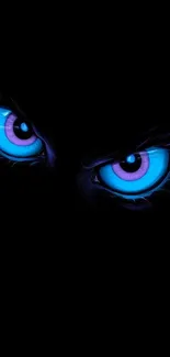 Mystical glowing eyes with blue and purple hues on a dark background.