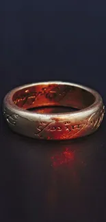 A golden ring with intricate engravings, glowing mysteriously.