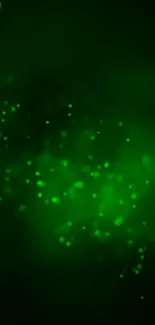 Abstract green particles glowing on a dark background in this modern mobile wallpaper.