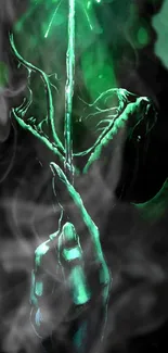 Mystical green hand with smoke effect wallpaper.