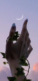 Hand reaching for crescent moon with ivy on a pastel sky background.