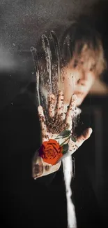 Hand on glass with a red rose, mystical art wallpaper.