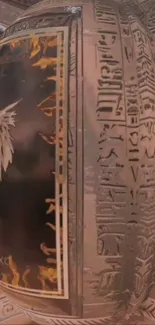 Mystical wallpaper with hieroglyphics and winged designs on an orb.