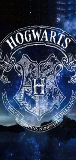 Hogwarts emblem on a mystical night sky wallpaper.