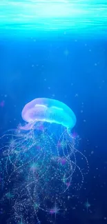 A glowing jellyfish in a serene blue ocean scene wallpaper.