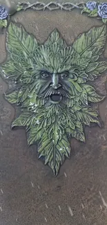 Green Man wallpaper with leafy design in earthy tones.