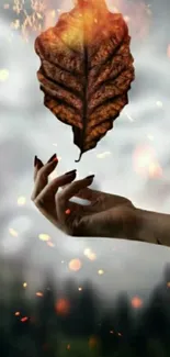 Hand holding a burning leaf with fiery embers.