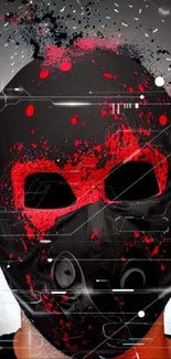 Black mask with red splashes on a dark background, artistic wallpaper.