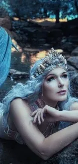 Mystical mermaid with crown in blue water.