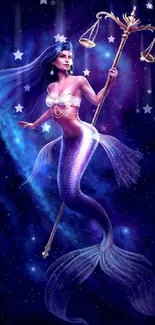 Mystical mermaid holding scales against a starry galaxy background.