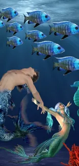 Enchanting underwater scene with mermaids and marine life in the deep blue ocean.