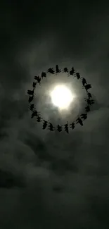 Eerie night sky wallpaper with a bright moon and birds silhouetted against dark clouds.