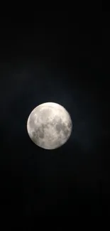 Full moon glowing in a dark night sky, creating a mystical effect.