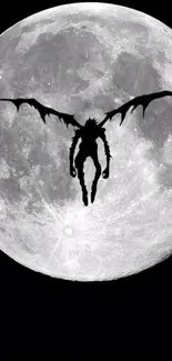 Silhouette figure with wings against full moon.