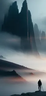 Mysterious mountain peaks with mist and lone traveler.