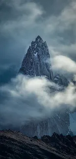 Mystical mountain peak with clouds surrounded by a serene sky.