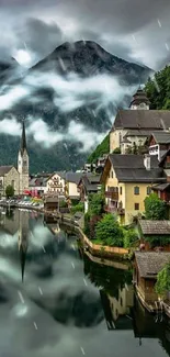 Scenic village with mountain and lake reflection.