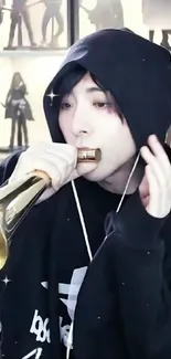 Musician in black hoodie playing trumpet passionately.