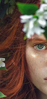 Enigmatic portrait with green eyes, surrounded by leaves and flowers.