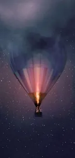 Hot air balloon sailing in starry night sky with mystical clouds.