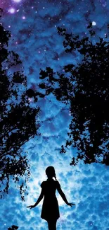 Silhouette under a starry night sky with trees.