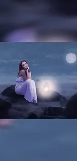 Woman sitting on rocks under a moonlit night sky with fog and a lantern.